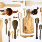 Wooden kitchen utensils on white background - knolling concept